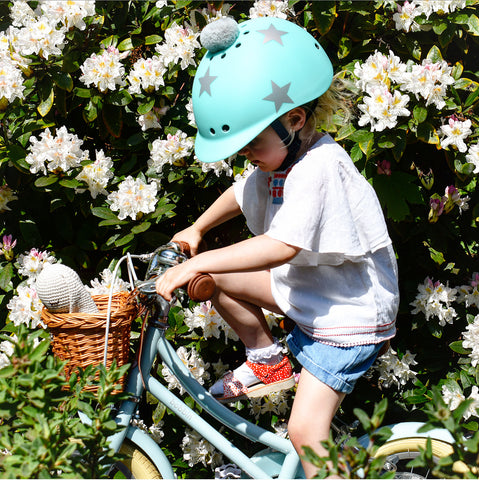 Grace riding with a Sawako turquoise star helmet 