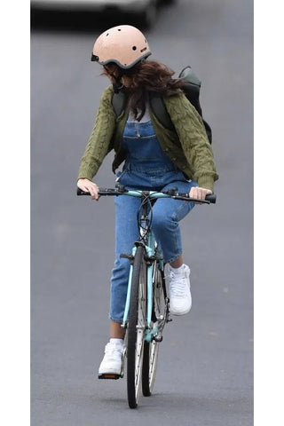 Michelle Keegan with Madison beige helmet looking back on her bike