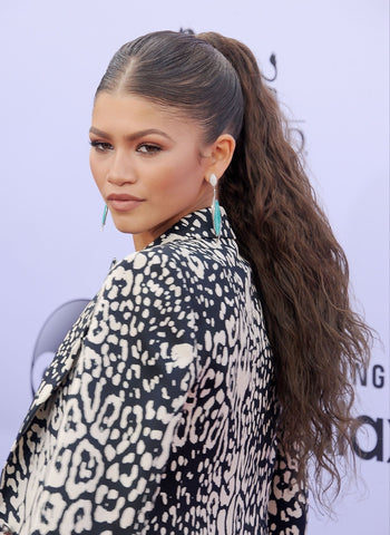 zendaya with updo hairstyle and teased ponytail