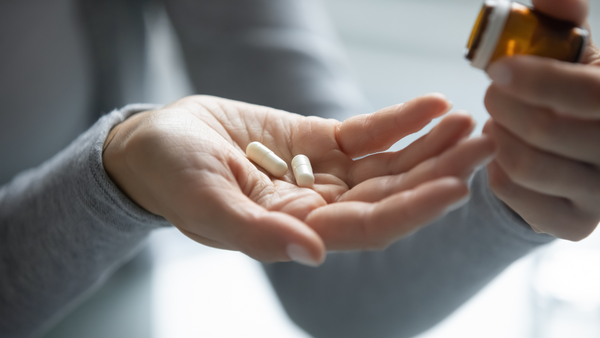 Probiotic capsules in a woman's hand