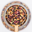 A scoop of Jaipur Summer chai. Made with black tea, hibiscus, oranges and cardamon. 