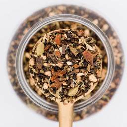 Chai Tonic Loose Leaf Tea Blend Scoop. Made with black tea, tulsi, elderberries, cardamom, ginger, star anise, brahmi and ajwain.