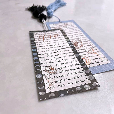 two handmade bookmarks on a marble countertop