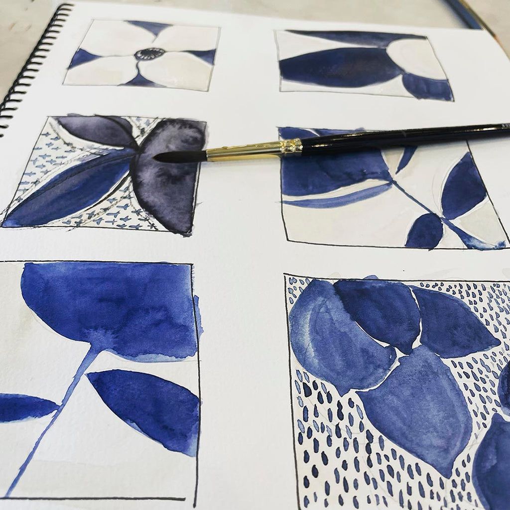 sketchbook page with six rectangles each with artwork composition ideas painted in blue and paynes gray