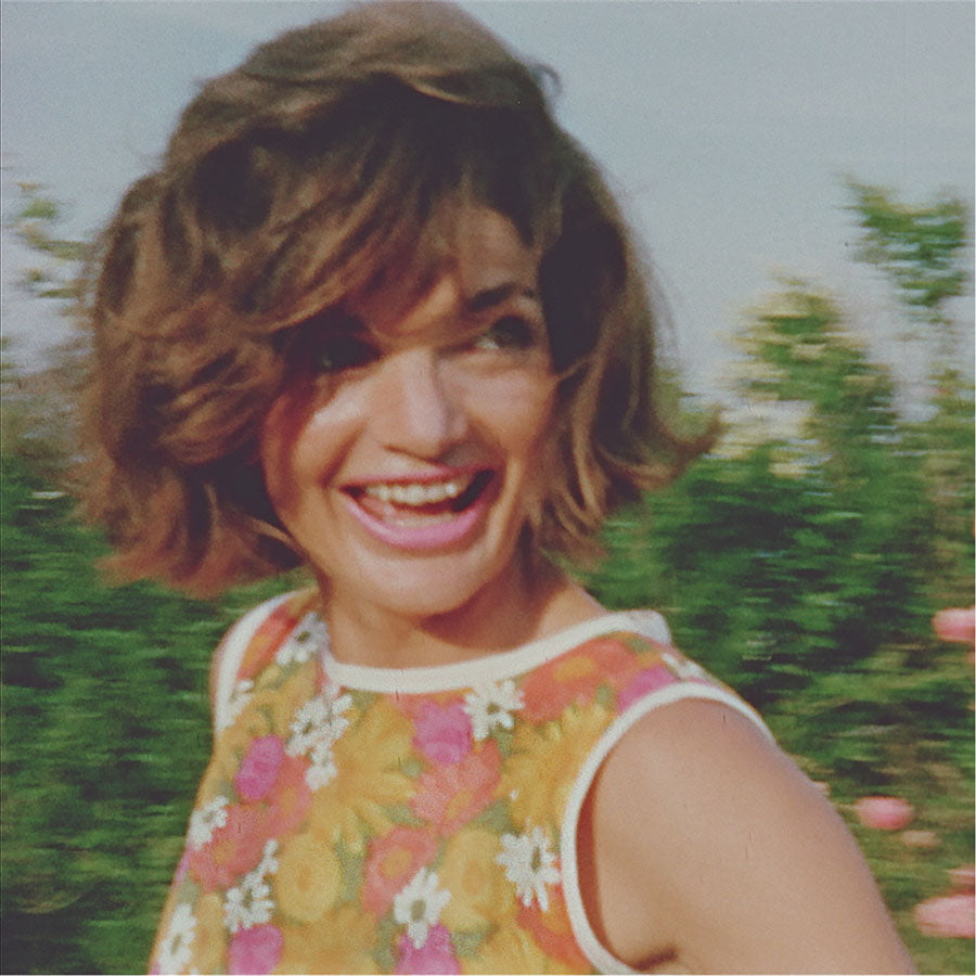Carefree Jackie Kennedy in a printed shift dress