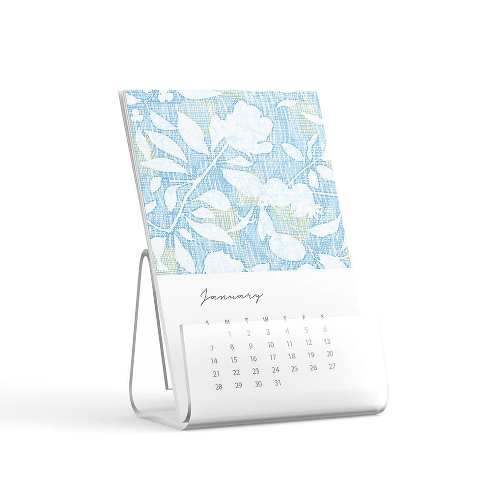 5x7" calendar page with artwork for january 2024 in a bent acrylic stand on a white background.
