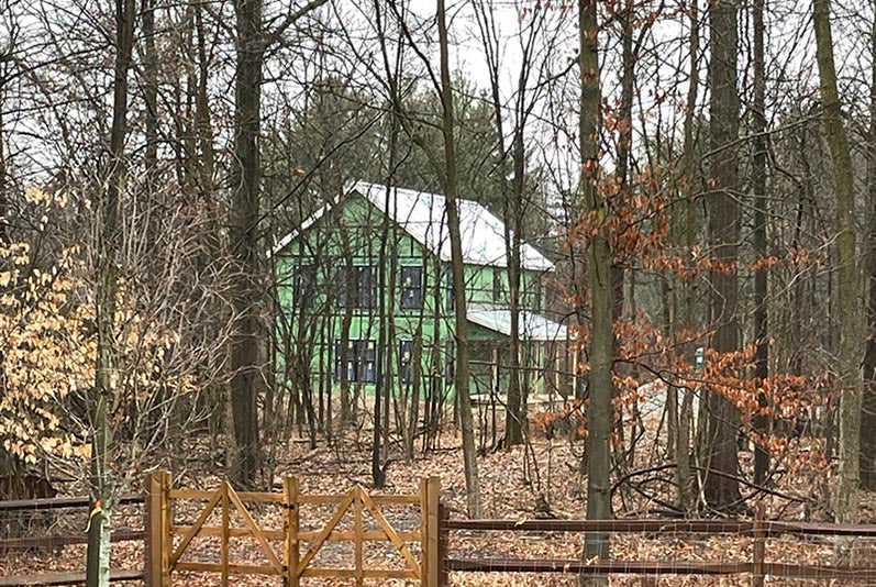 building in progress with roof and windows no siding