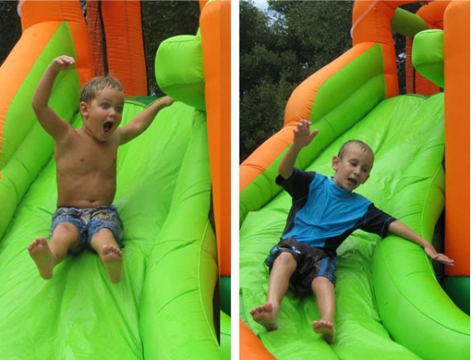 Kidwise Endless Fun 11 in 1 Bounce House and Waterslide boys on slide