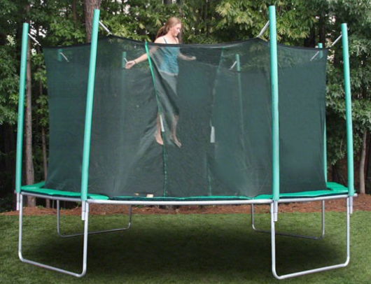 jumping on the magic circle octagon trampoline with safety enclosure