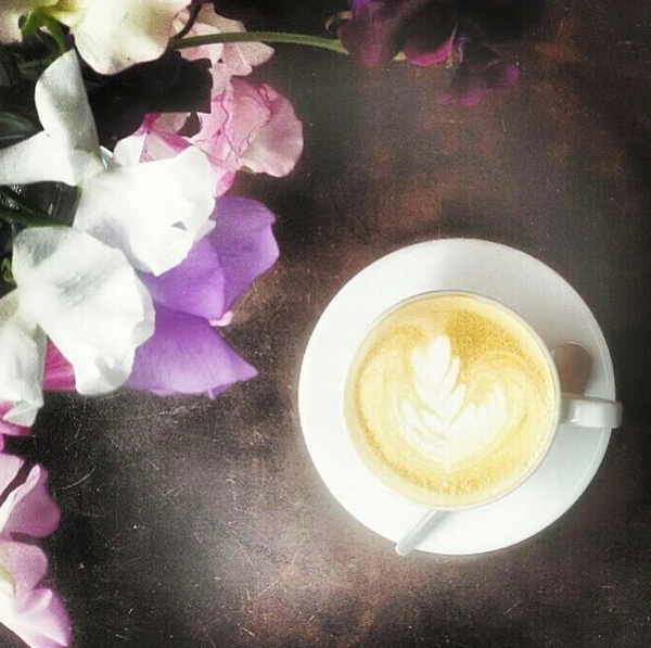 Coffee with purple and white orchids