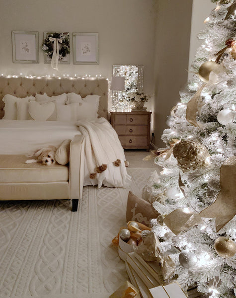 a cozy bedroom with Christmas tree white christ purple decorate santa jesus festive