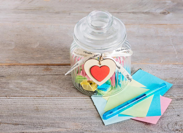 a glass jar full of colored paper employee appreciation day encourage employees workplace gratitude family members