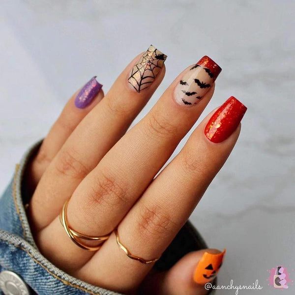 a hand with nail art made from different colors and Halloween nails designs nails nails nail designs nails nails nails