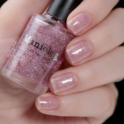 Pink-tinted nails with holographic glitters