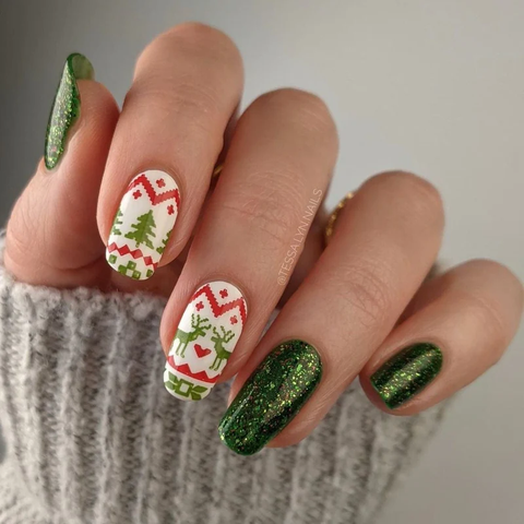A green and white christmas manicure with ugly holiday sweater accents.