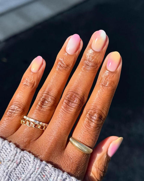 nail art with pastel colors on dark skin
