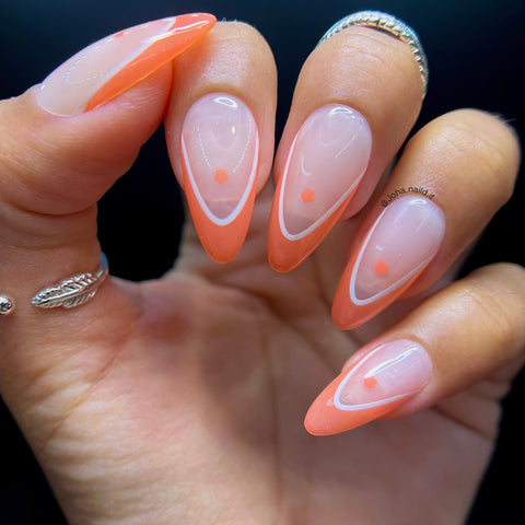 Accented French orange tips with white outline