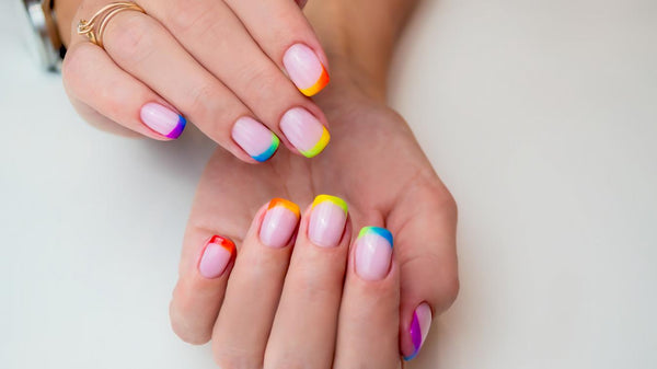 someone's hand with rainbow nail designs play tip pop trend glitter tip winter trend nails nail design nails nail design nails nail design ideas wrong fingers