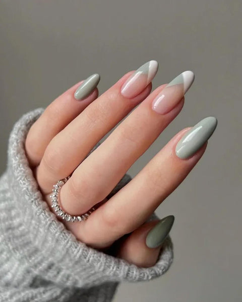 someone's hands with sage green geometric french tips nails french tip nude glitter elegant pink glitter nude glitter classy nail