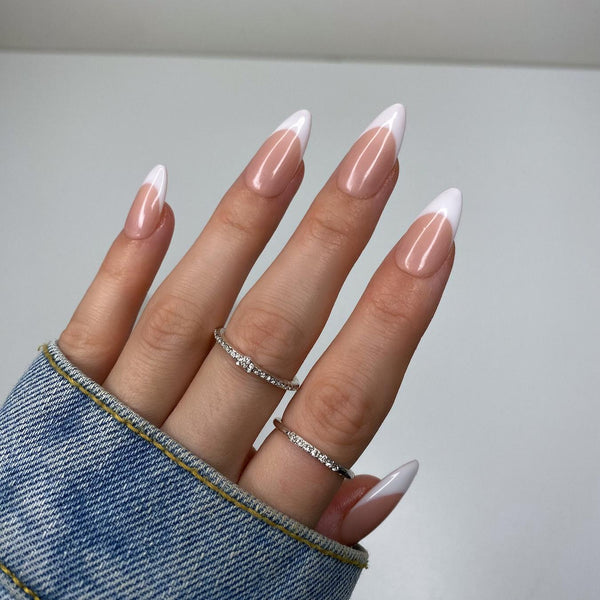 someone's hands with white french tips short nails nude short nails prefer classic nude shade shades