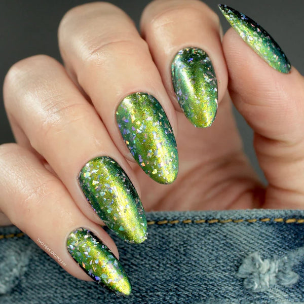 someone's nail art with sparkles olive green base olive green design features accent nail blue
