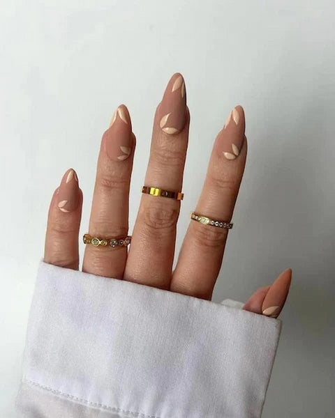 someone's nails with brown colors of nail polish nail design