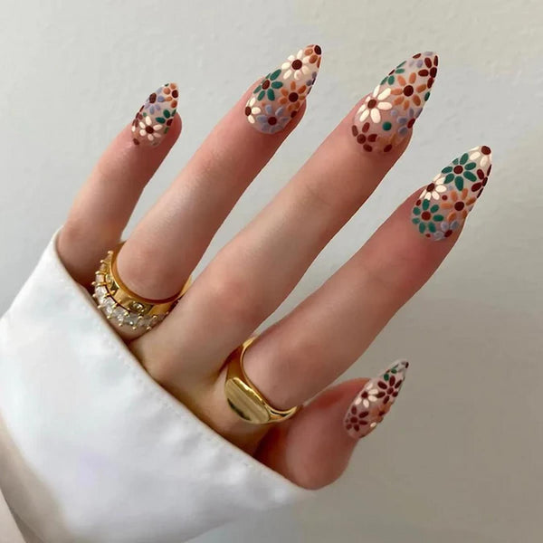 someone's nails with flower designs manicure manicure