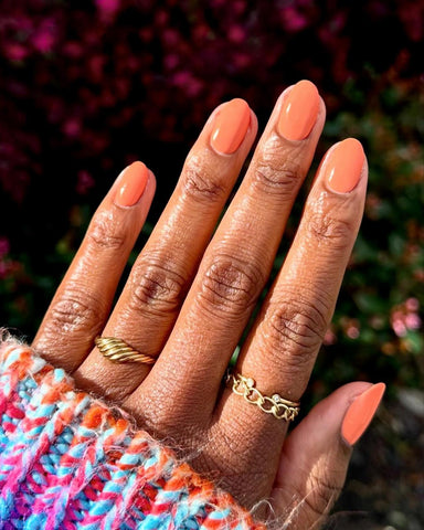someone's nails with orange nail polish nude classic tropical salon sea nail look nail artist nail design summer beach