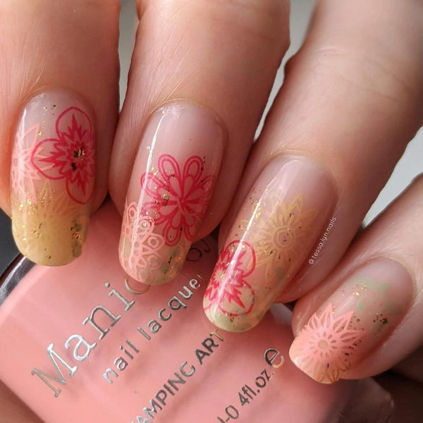 someone's nails with floral nail art