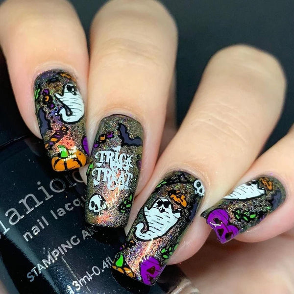 someones hand with halloween themed nail art go trick or treating jack o lantern family traditions local farm front door friendly ghost stories holiday led candles harvest season plastic spiders adams family family