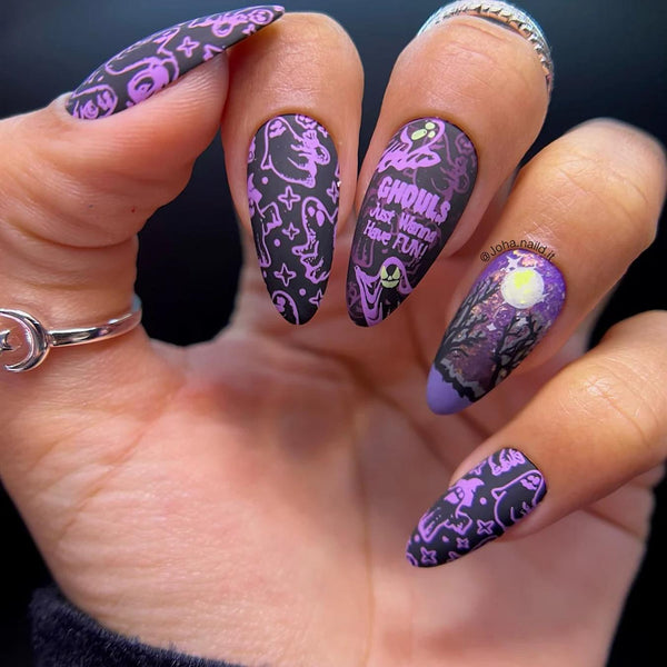 someones hand with purple decorated nail art jack skellington nails nails middle finger black cats nails nails