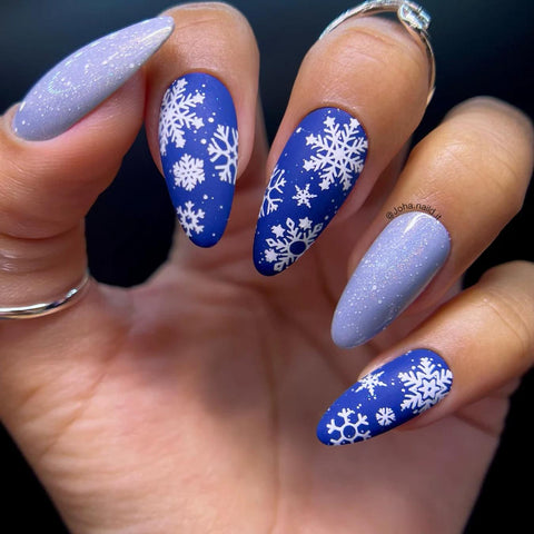 white and blue snowflake designs two nails nail jewels different shade christmas y nail look plaid print other nails white polish nails ideas