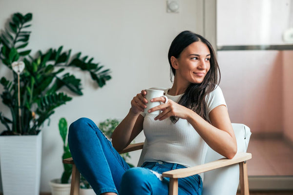 woman drinking tea in a chair gift basket gift baskets amazing self care basket appreciated loved one epsom salts basket fill basket loved ones