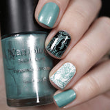 A manicured hand made with Metallic Blue Stamping Polish from Morning Glory collection Delphinium (B336) by Maniology.