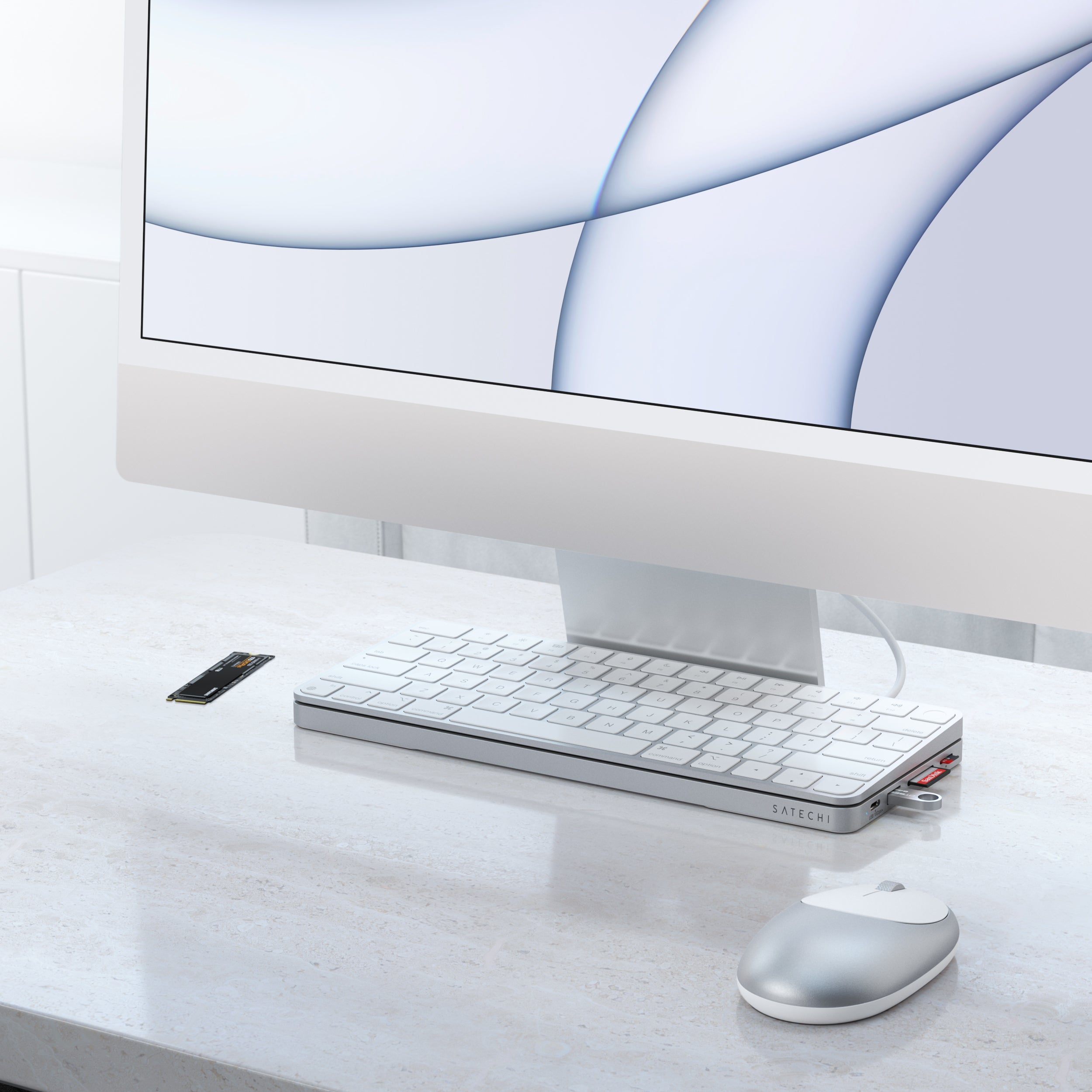 Designed to fit the 2021 iMac (24-inch) exclusively, the Satechi USB-C Slim Dock for 24” iMac provides a built-in enclosure to add external storage to your iMac and convenient access for all your most-loved ports and peripherals. Featuring a 10 Gbps USB-C data port, 10 Gbps USB-A data port, 2 x USB-A 2.0 ports, micro/SD card reader slots, and NVMe Sata Enclosure, the USB-C Slim Dock upgrades your iMac’s functionality while maintaining a sleek aesthetic all with a plug and play design.