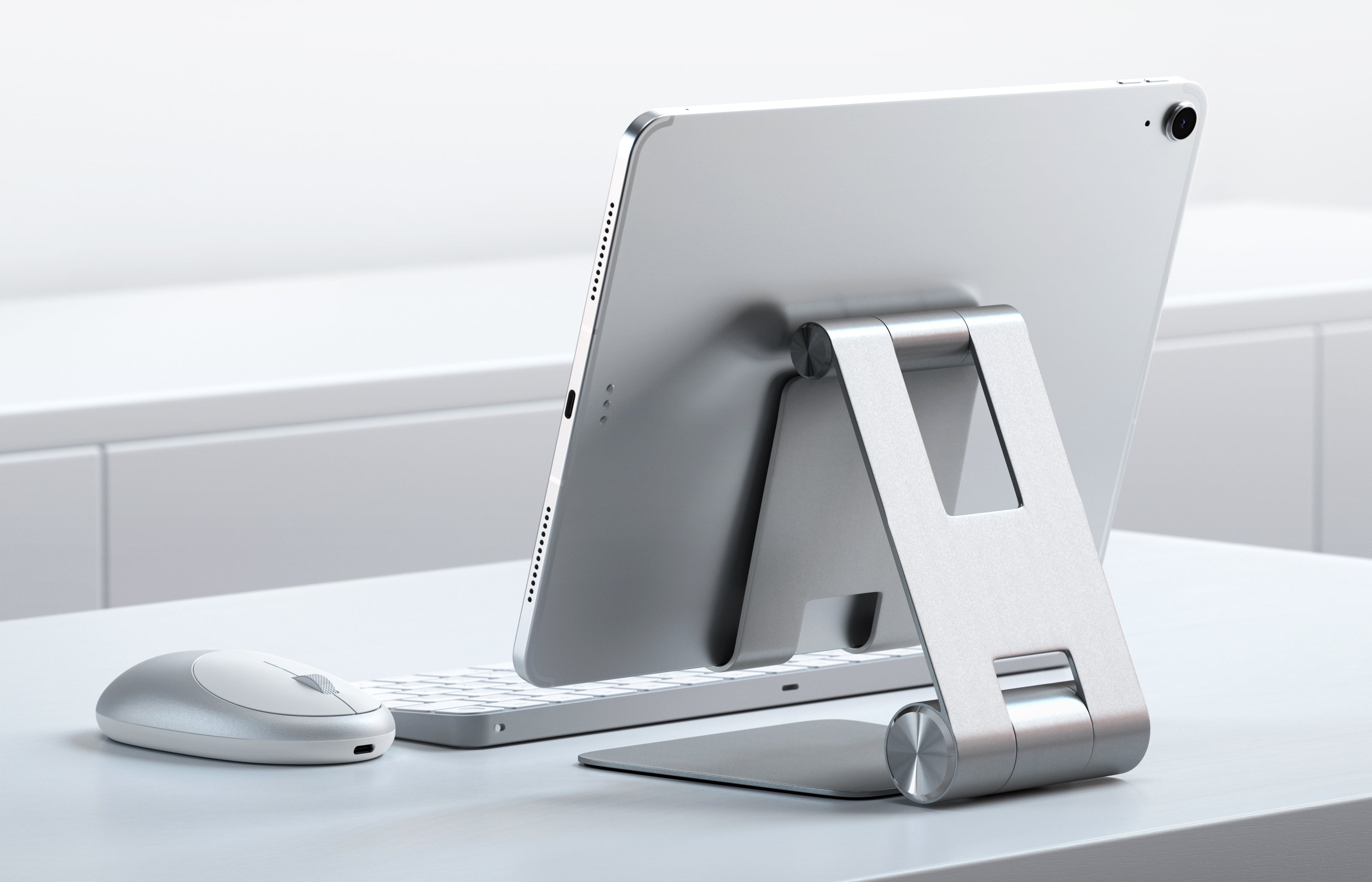 Our updated Satechi R1 stand quickly elevates any mobile device or tablet for an optimal viewing experience. Constructed from solid aluminum, the R1's supporting grips are finished in rubber to hold your tablet without scratching or slipping. It's compatible with most cases too.