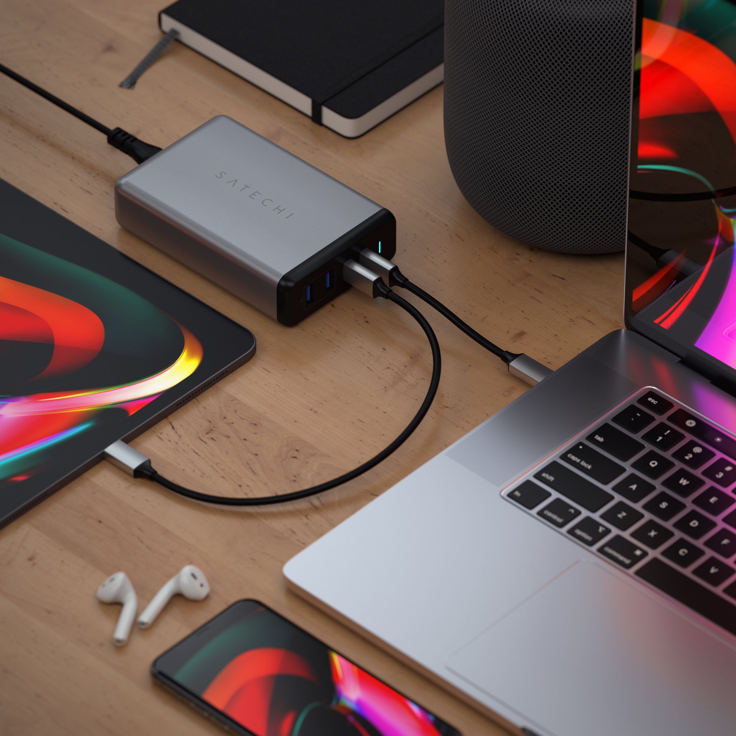 Satechi 108W pro usb-c pd desktop wall charger on a desk charging a MacBook Pro and iPad 