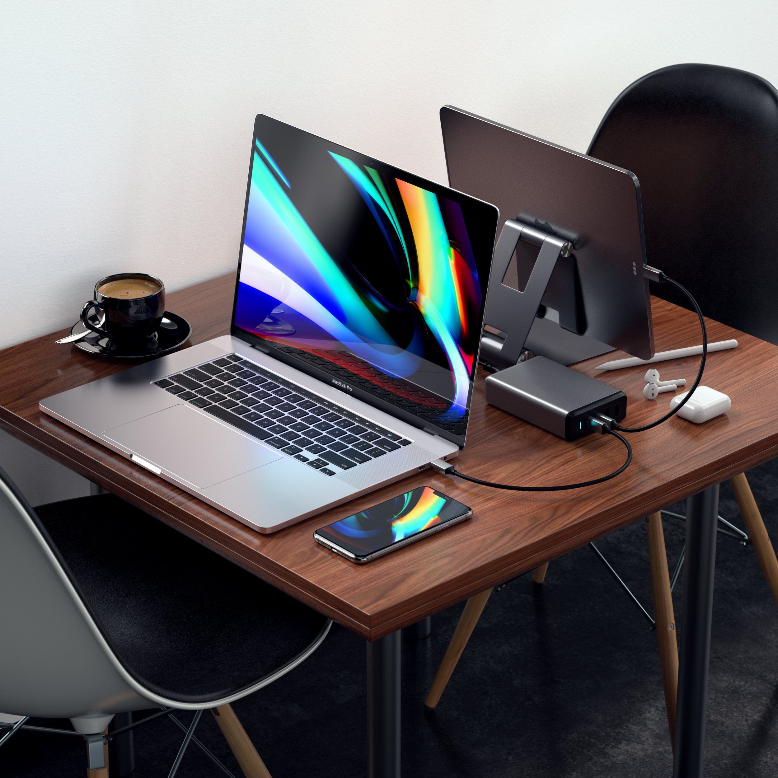 Satechi 108w pro usb-c pd desktop wall charger on a desk simultaneously charging a MacBook Pro and iPad Pro