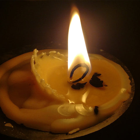 Is it normal for the wick in (soy pillar wax) taper candles to curl like