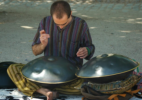 man with two large steel tongue drums playing