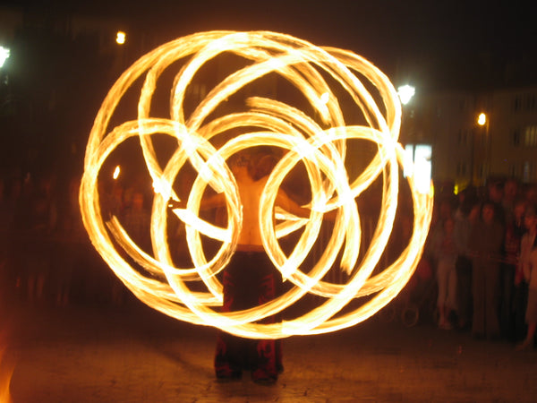 artist flowing with fire poi
