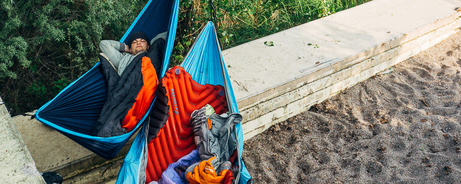 Man camps in a hammock