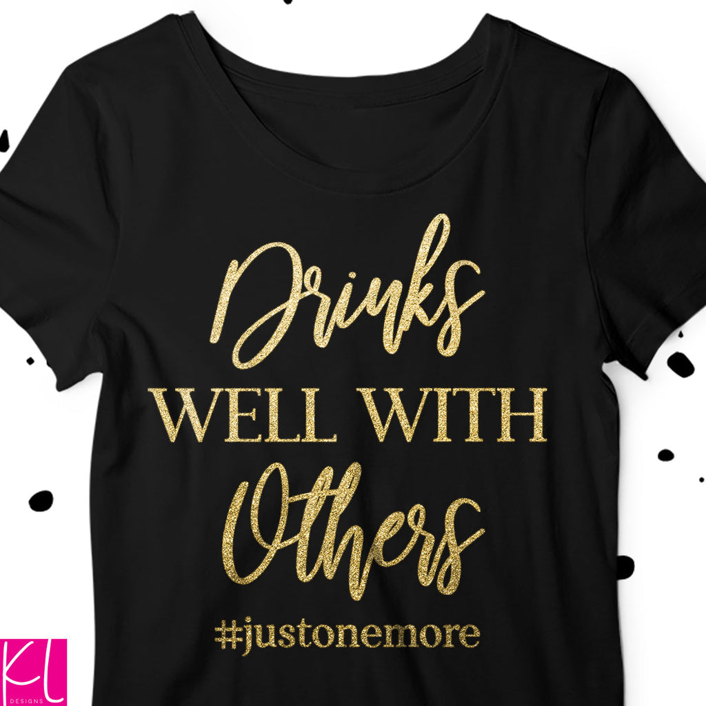 Drinks Well with Others svg quote on a black t-shirt for a night on the town with the girls