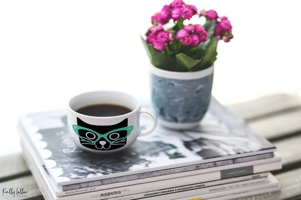 White coffee mug with the Cat with Glasses svg in black and mint