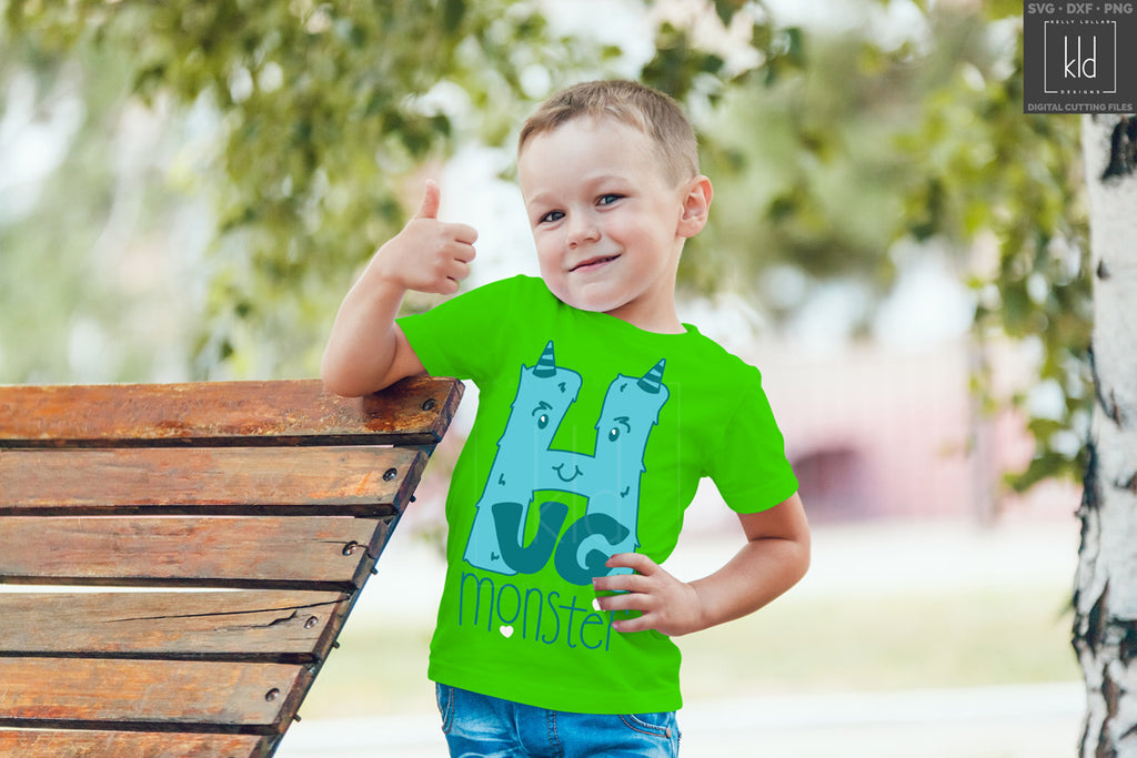 Green boy's shirt with the Hug Monster svg in blue