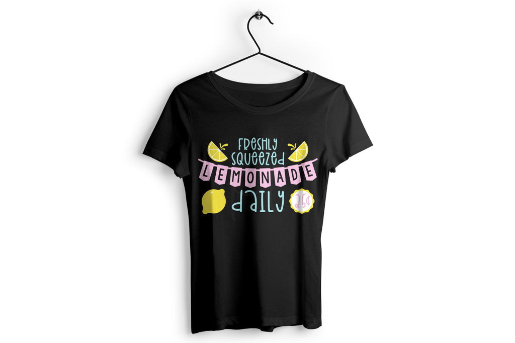 Women's black shirt with the Lemonade Stand svg cut file in blue, pink, yellow and white