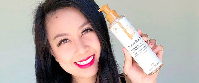 Woman holding Derma E Acne Cleansing Wash
