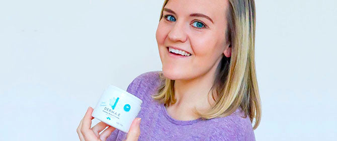 Woman holding derma e exema cream