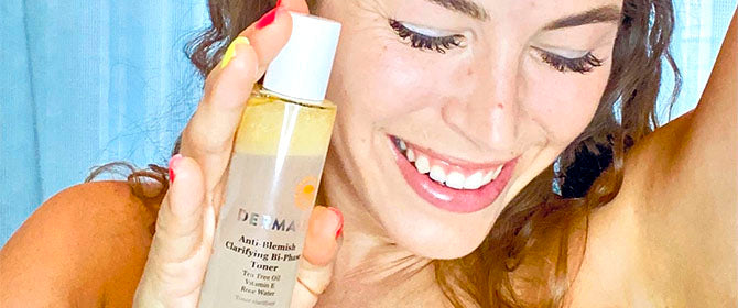 Woman holding the Derma E Anti Acne Toner