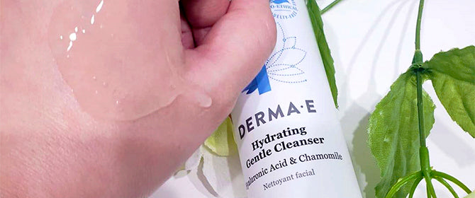 Person with Gentle Cleanser on their hand, showing the texture and consistency of the clear cleanser